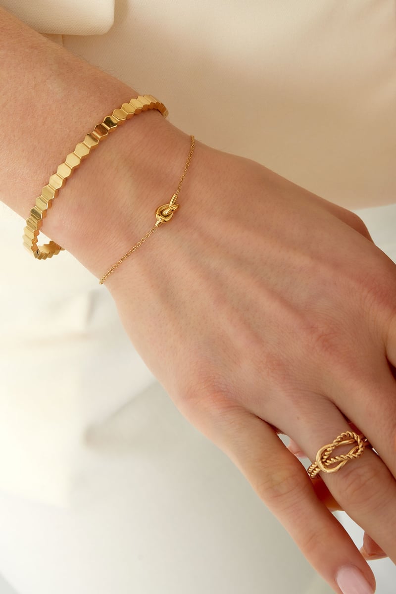 Simpele armband met geknoopte bedel - Goud of zilver
